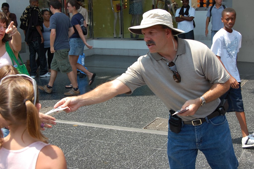 Handing out gospel tracts 
